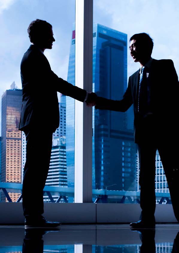 Two business partners shaking hands